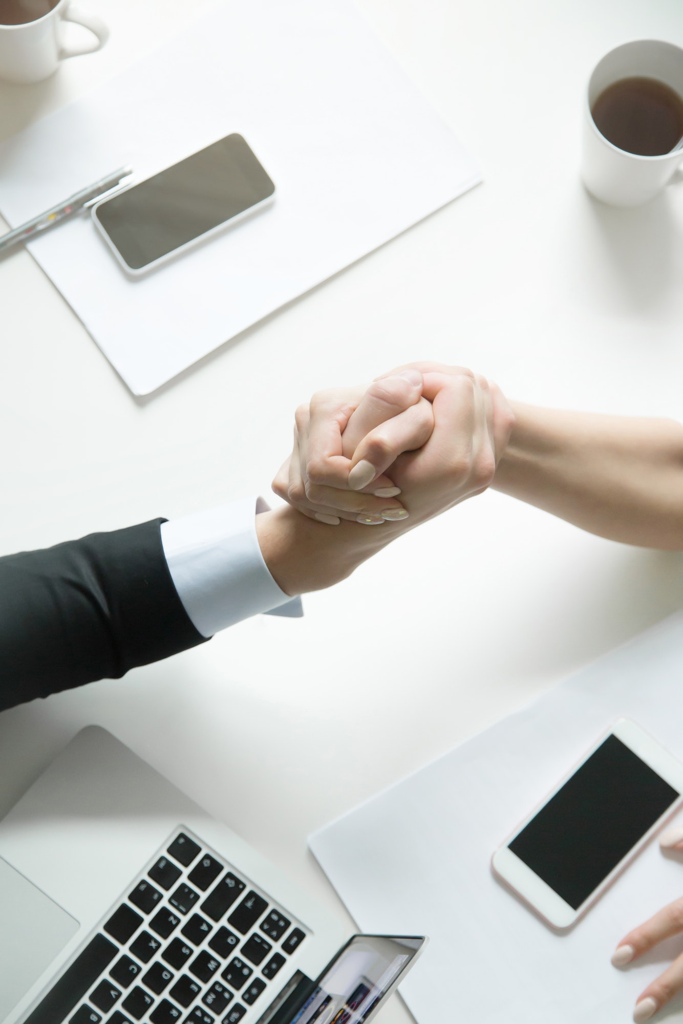 Businessman and businesswoman armwrestling